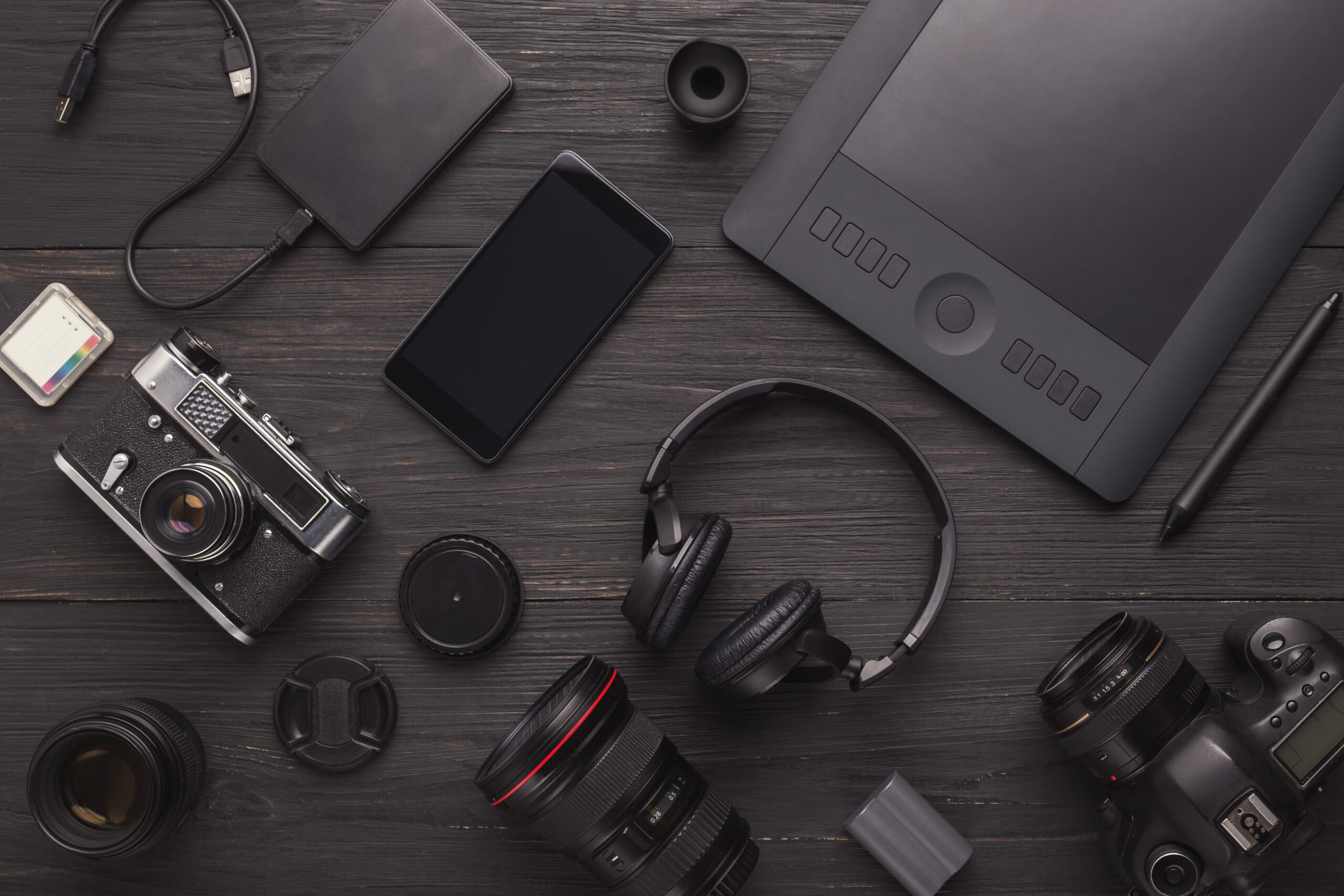 Photo equipment. Top view of diverse personal equipment for photographer or creative designer, copy space